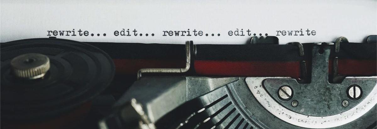 rewriting and editing quality magazine content on an old fashioned typewriter