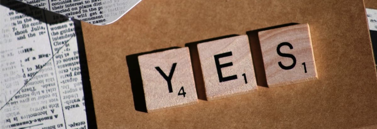 Word game tiles spelling the word 'yes' represent the drive to put customers at the heart of a business